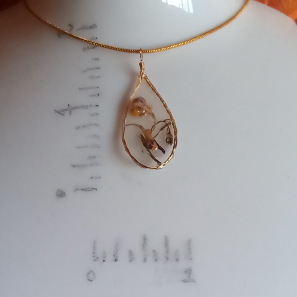 Floral necklace, amulet
